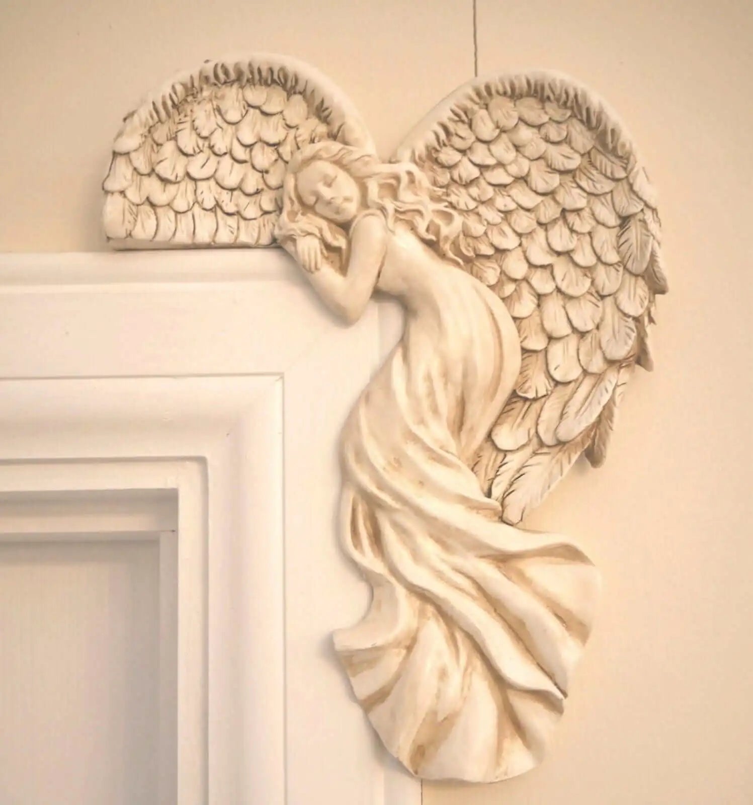 Turn any doorway into a heavenly entrance with our Angel Wings Door Frame Decorator. This unique and quirky product adds a touch of whimsy to your home decor while also serving as a practical tool to decorate door frames. Create a heavenly welcome for anyone who enters your home!